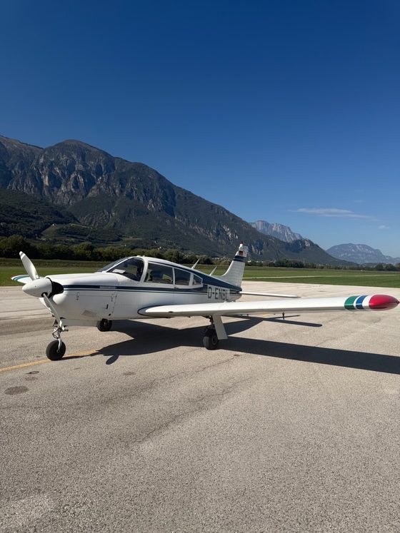 Piper Arrow D-ENBL at Trento-Mattarello airfield, mountains behind