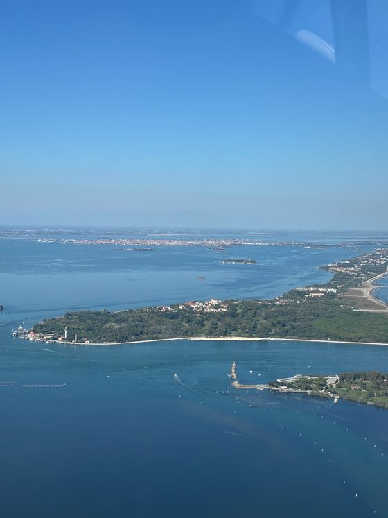 Venice's lagoon and the wooded spit of the Lido from an aircraft