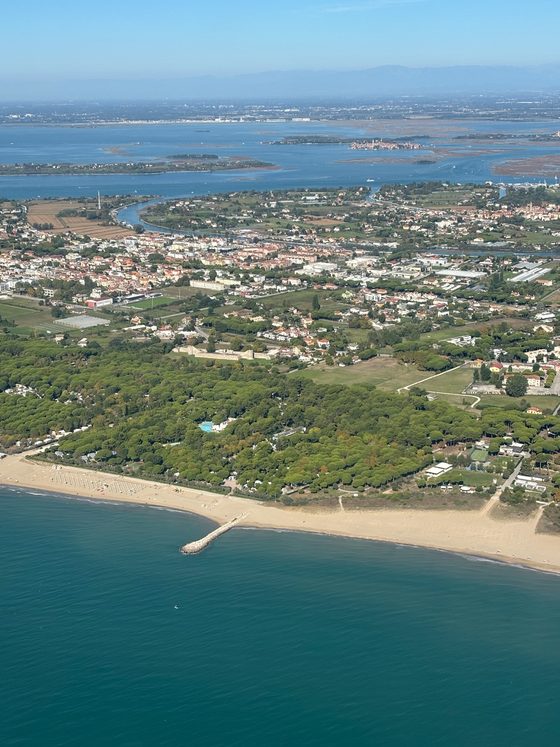Aerial view of the Venetian Lido with beach, houses and lagoon